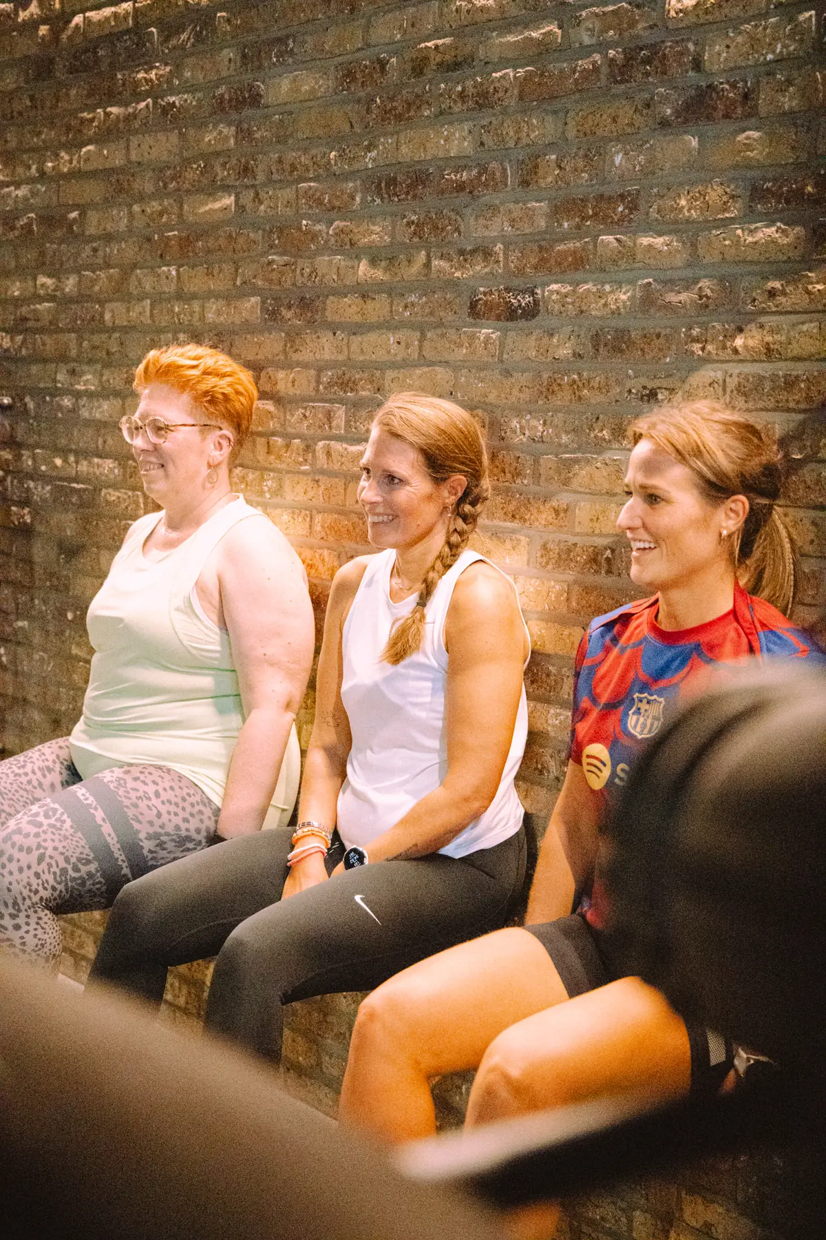 Three group members laughing together after a session at BFZ