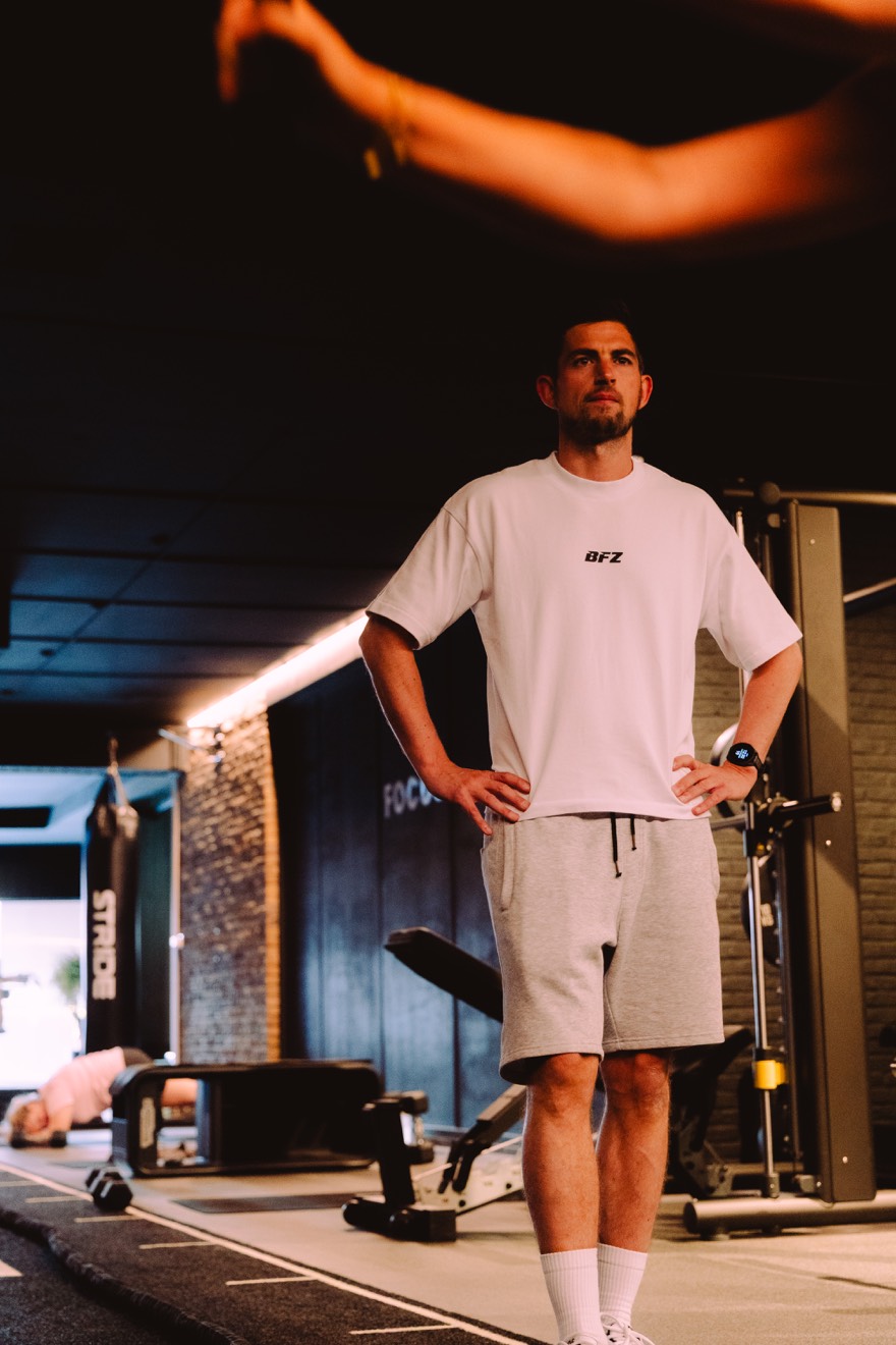 Coach in a white BFZ shirt following a session on the training floor
